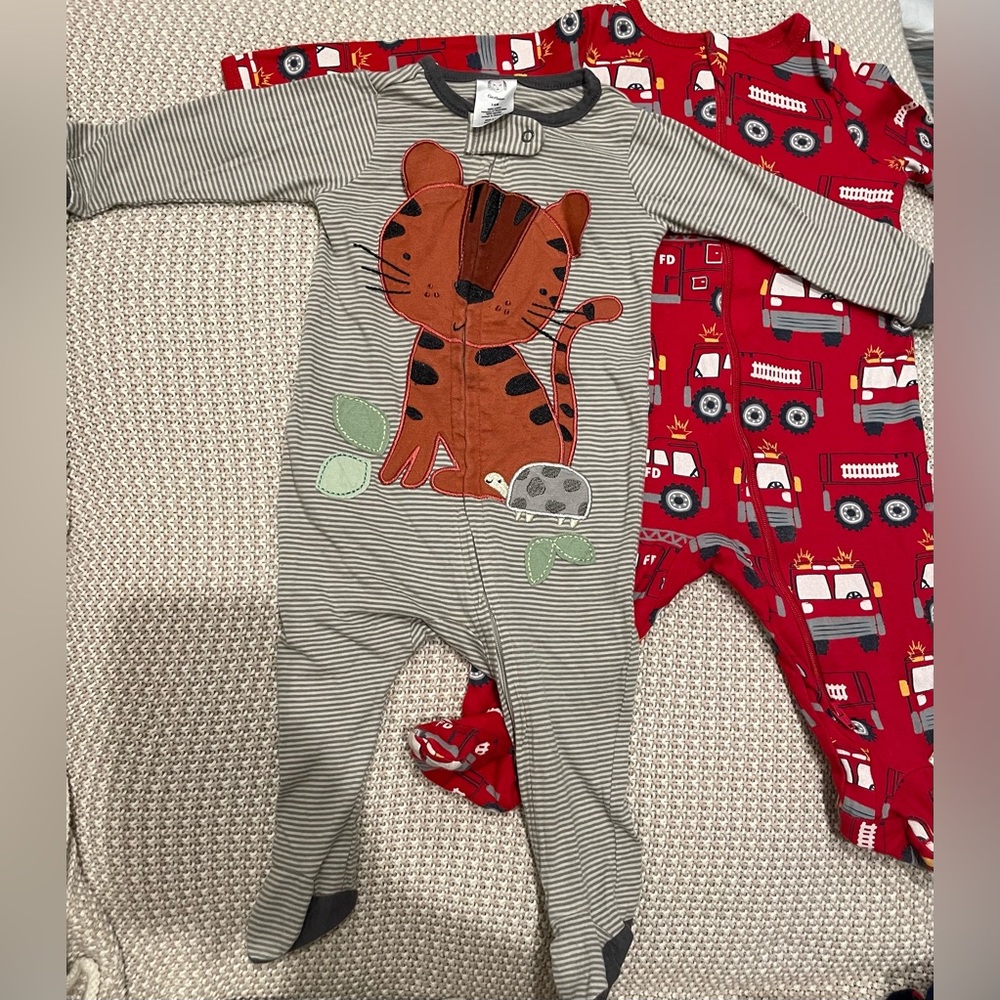 3-6 months Tiger Footsie is by Gerber and Firetruck is by wonder Nation